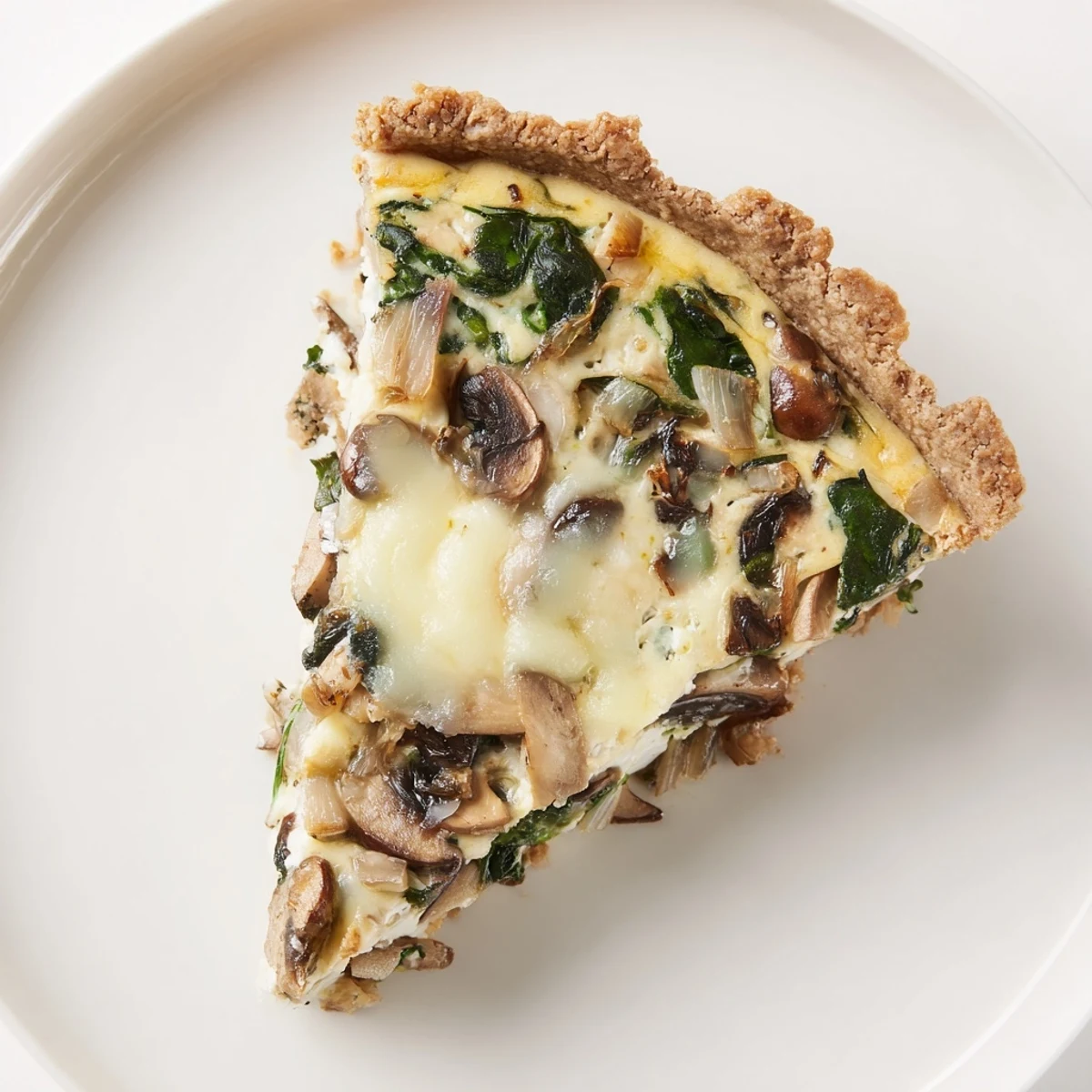Golden savory quiche, boasting a flaky crust and filled with creamy, cheesy goodness, ready to serve.