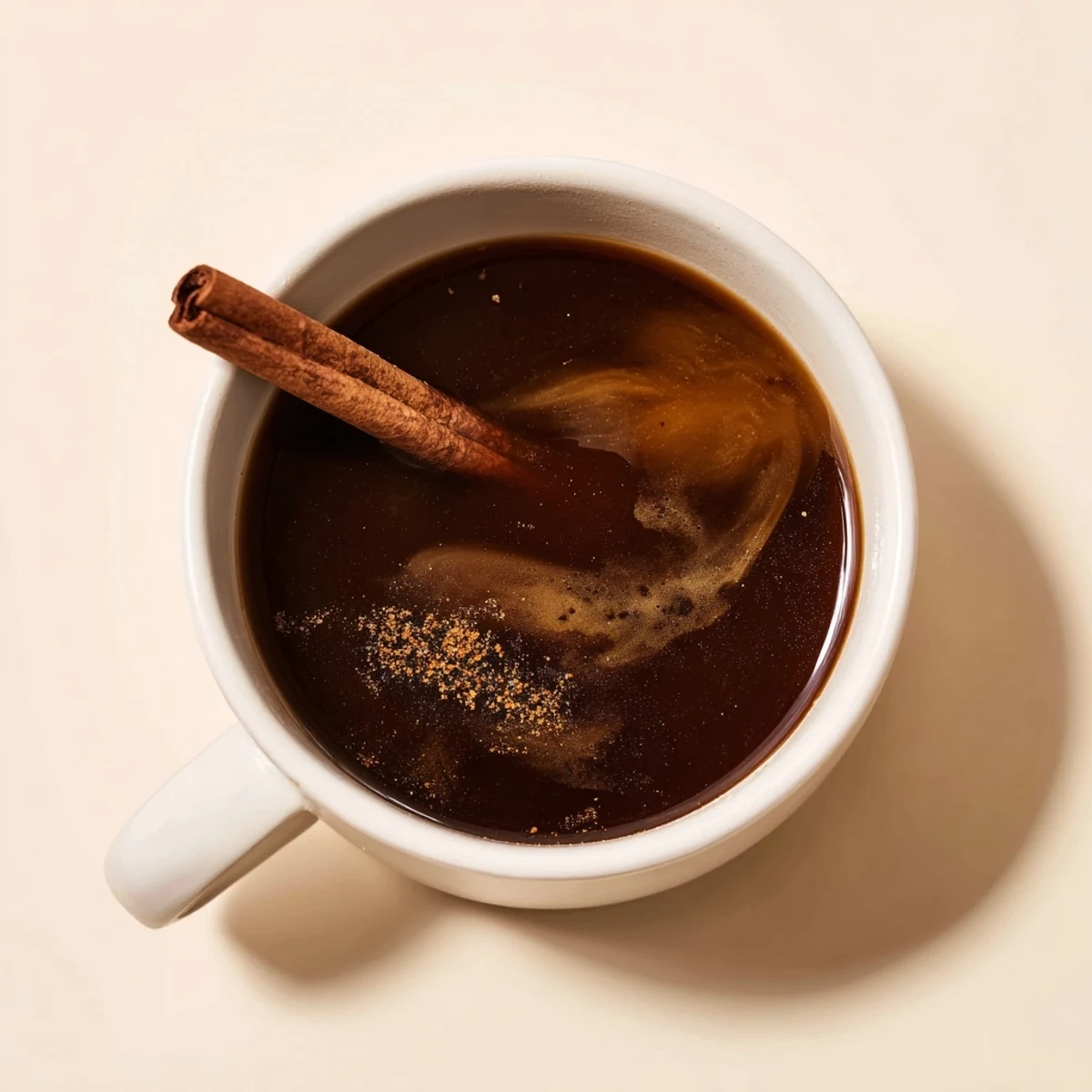 Close-up of freshly brewed Spiced Coffee, with visible spice remnants, perfect for a cozy morning.