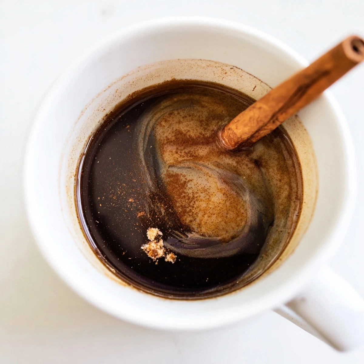 Enjoy a swirl of creamy Spiced Coffee with a hint of nutmeg, a comforting after-dinner drink.