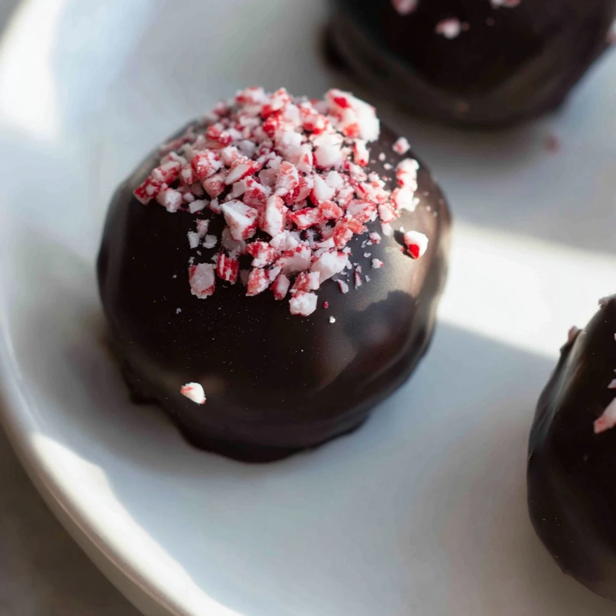 Rich, dark chocolate-covered Peppermint Mocha Truffles, promising a burst of cool mint and coffee.