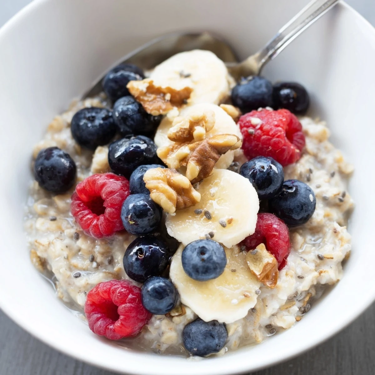 Healthy Creamy Breakfast Oats served in a rustic bowl with maple drizzle and walnuts, ready to eat.