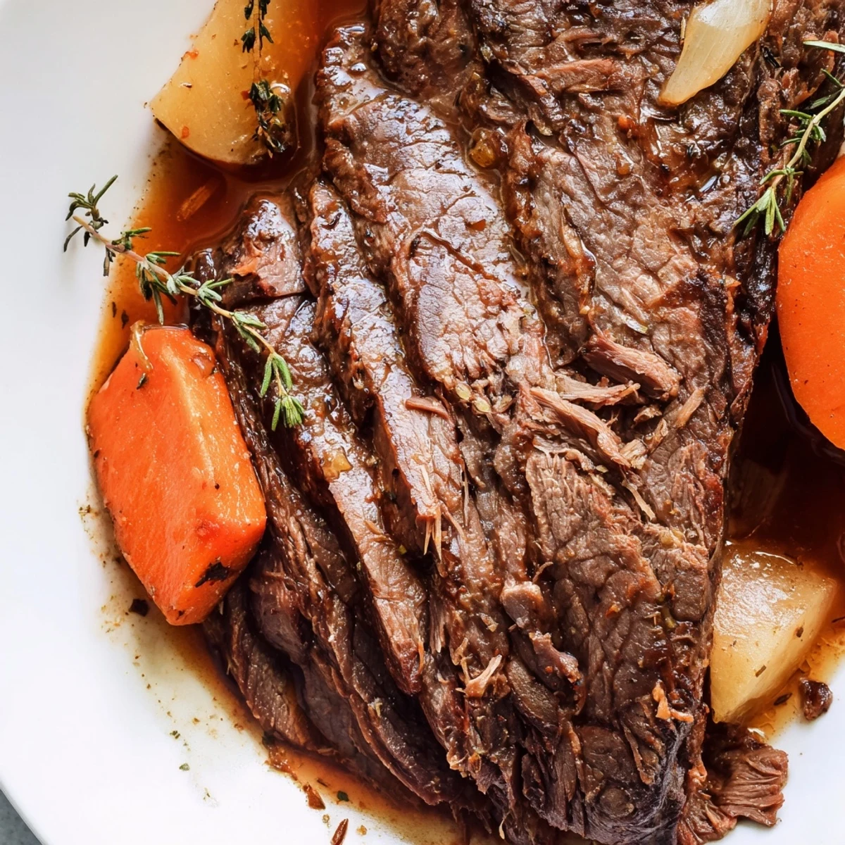 Golden-brown Beef Supper Roast with tender potatoes and carrots, freshly pulled from the oven and resting in a Dutch oven.