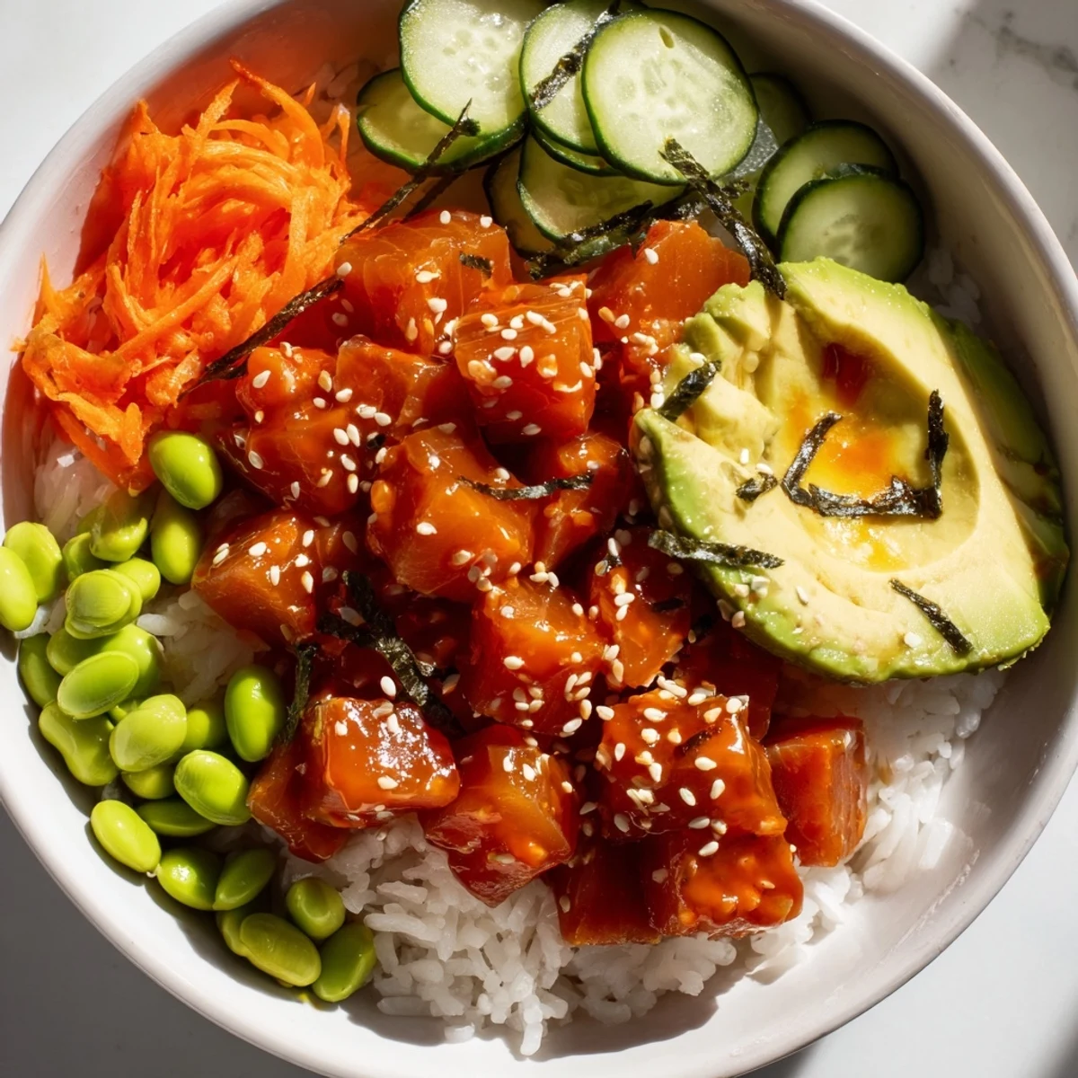 Brightly colored spicy tuna poke bowl garnished with sesame seeds and green onions, served ready to enjoy after 20 minutes. 