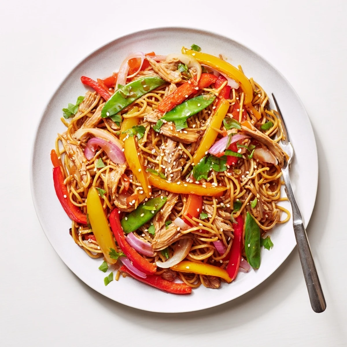 Close-up of the Sweet Chilli Turkey Noodle Stir Fry featuring crisp vegetables, noodles, and a garnish of sesame seeds.