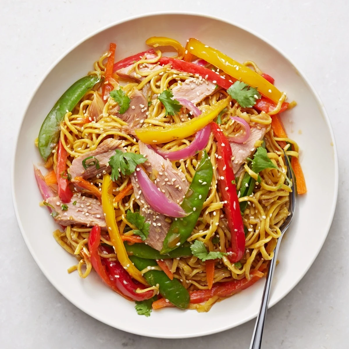 Steaming Sweet Chilli Turkey Noodle Stir Fry with vibrant bell peppers and tender turkey slices in a glossy sauce.