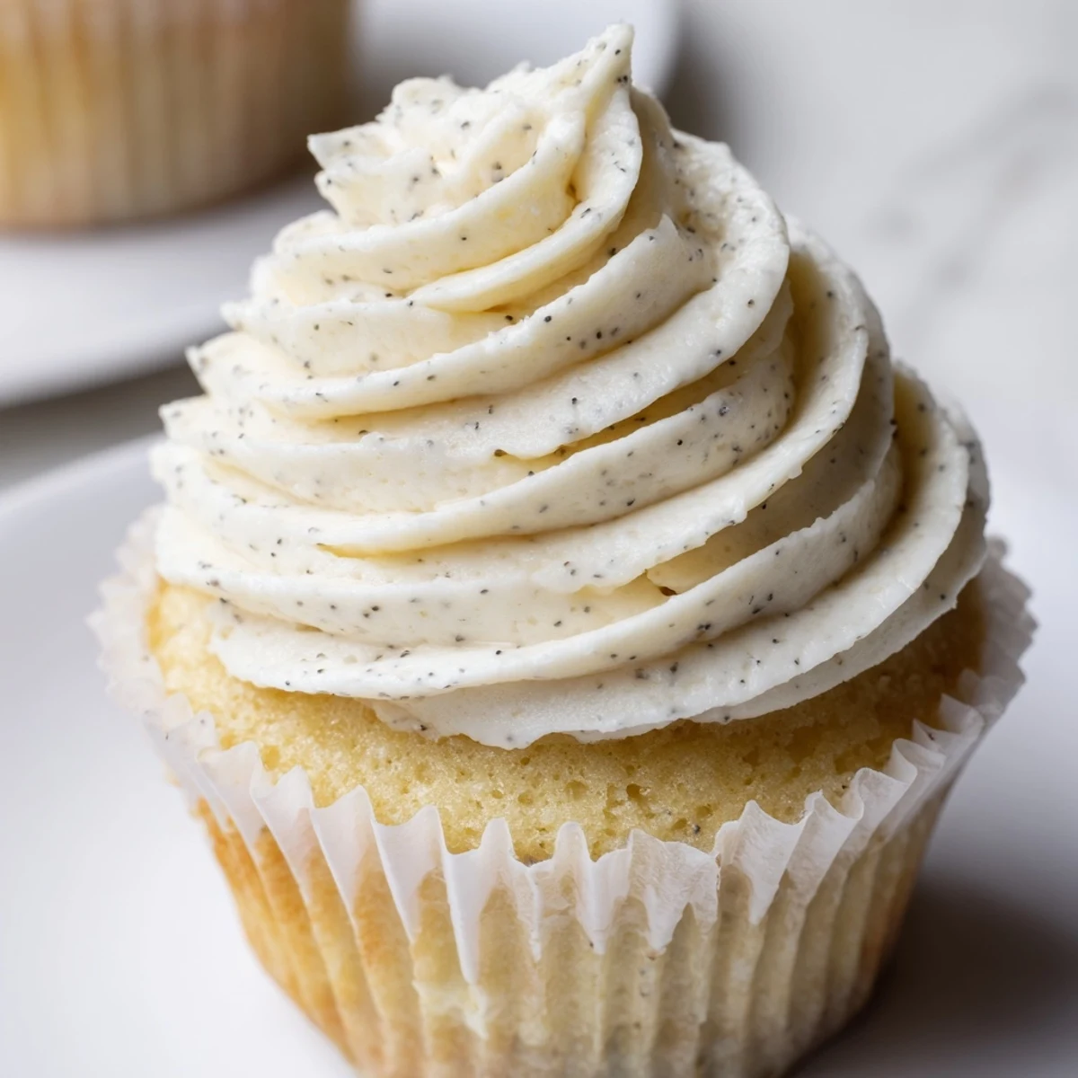Homemade vanilla cupcakes baked to golden perfection with smooth buttercream piping and festive decorations