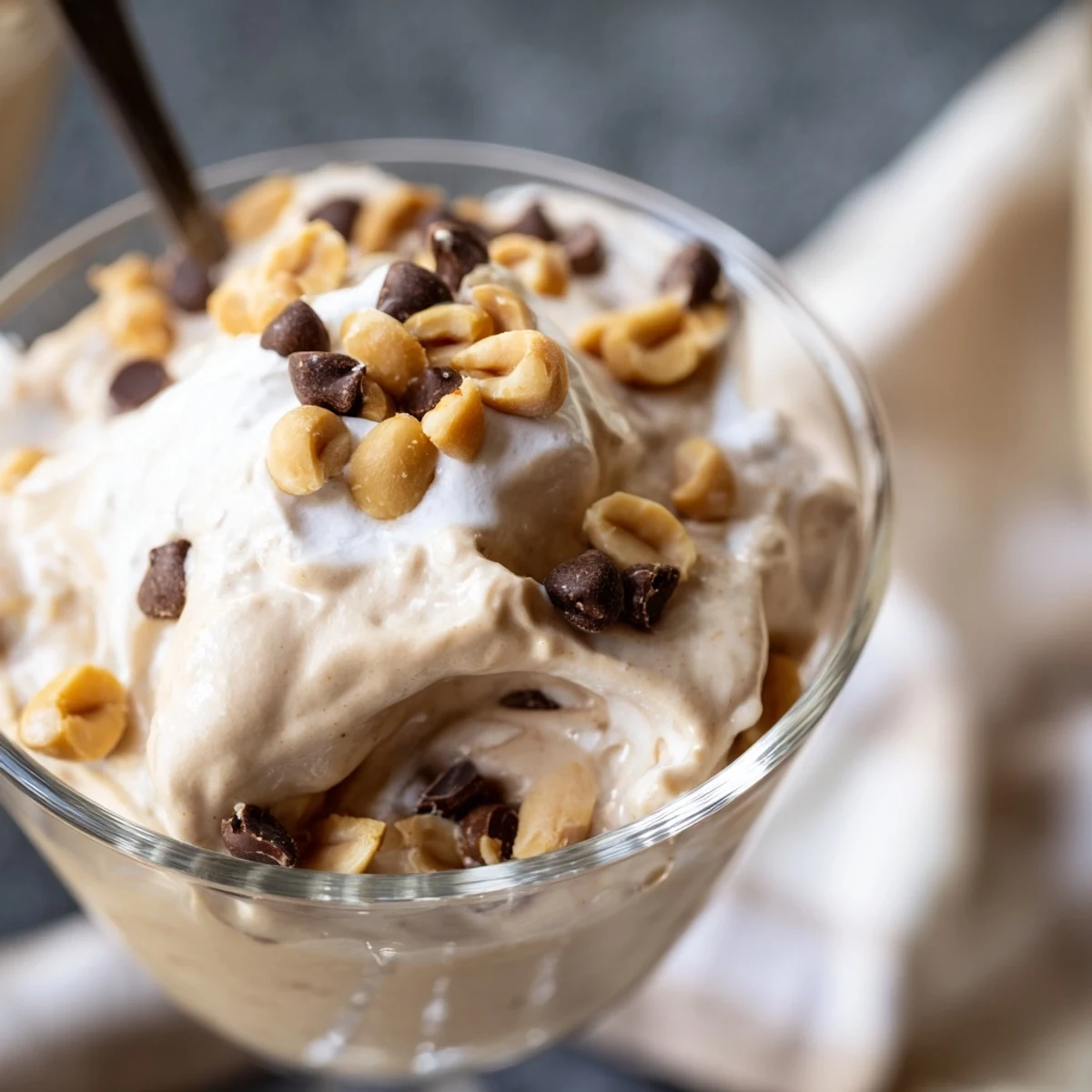 Light and airy peanut butter Cool Whip dessert dolloped into elegant serving bowls