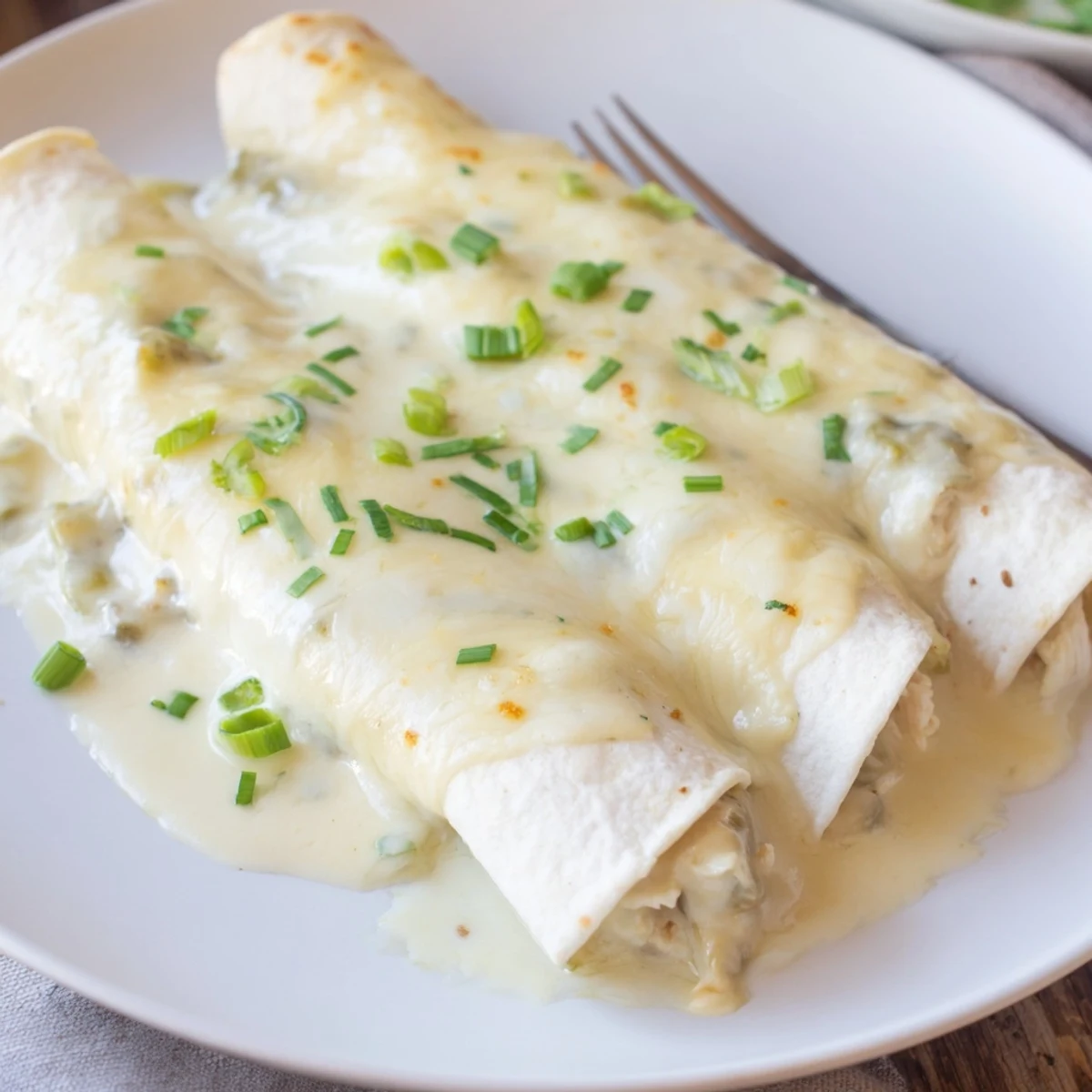 Creamy White Chicken Enchiladas fresh from oven, bubbling cheese and golden edges  