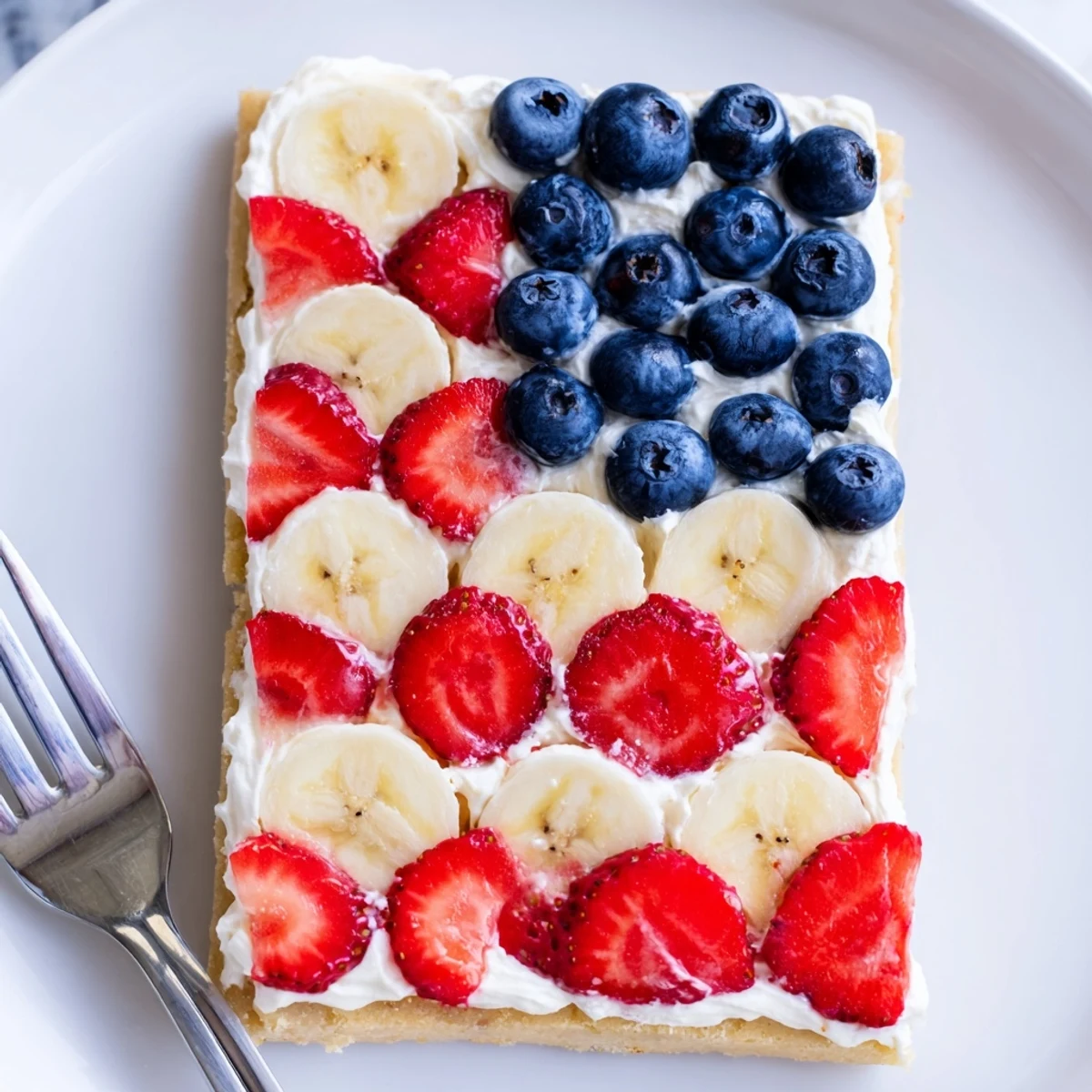 Ready to serve American Flag Fruit Pizza with sugared crust and silky frosting