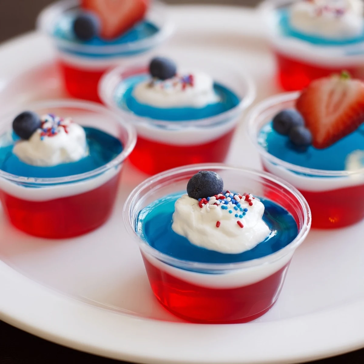 Red White And Blue Jello Cups shimmering, chilled layers topped with whipped cream