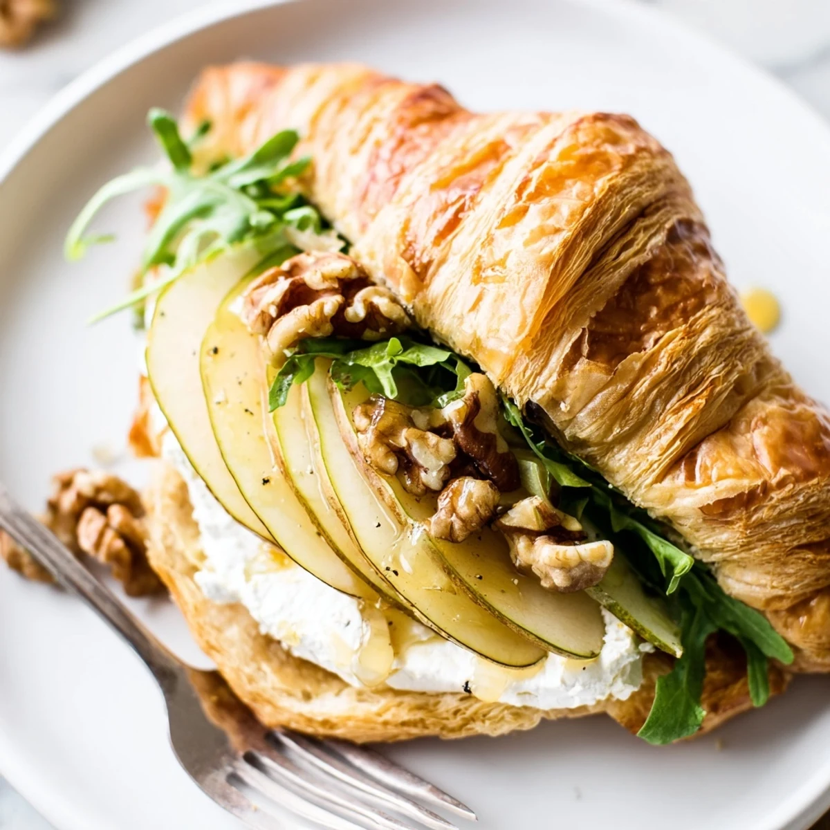 Buttery, flaky croissant filled with crisp apples and arugula — Apple Goat Cheese Croissant Sandwich