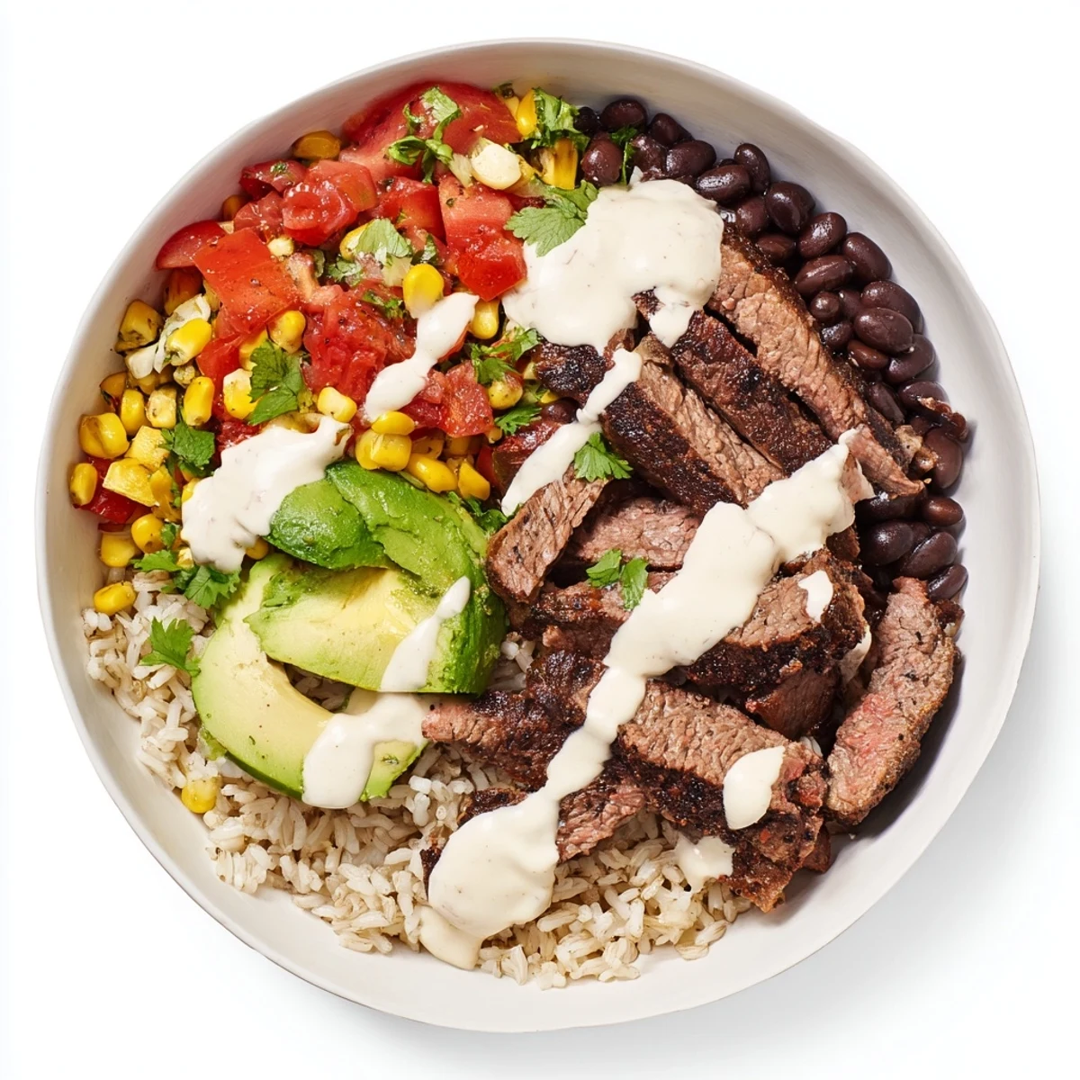 Sliced flank steak nestled over cilantro lime rice drizzled with warm melted queso sauce