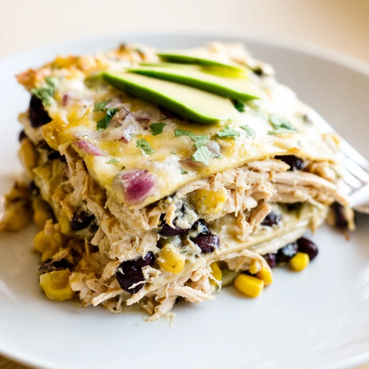 Creamy Salsa Verde Chicken Casserole served warm, garnished with avocado slices